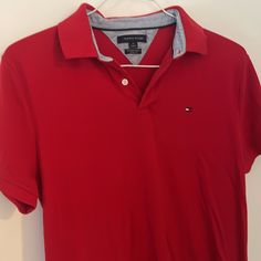 Size : M In Perfect Condition No Rips Stain Or Any Damage Red Polo With Logo On The Chest Area Pit To Pit 18" Classic Red Fitted T-shirt, Red Fitted Polo Collar T-shirt, Classic Fitted Red T-shirt, Fitted Short Sleeve Tommy Hilfiger Polo Shirt, Fitted Tommy Hilfiger Polo Shirt With Short Sleeves, Tommy Hilfiger Red Short Sleeve Top, Tommy Hilfiger Red Cotton Top, Red Cotton Tommy Hilfiger Tops, Tommy Hilfiger Red Cotton Shirt