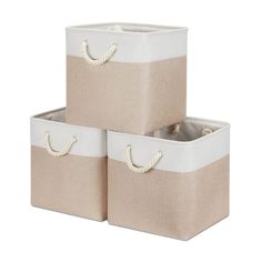 three white and beige storage baskets with handles