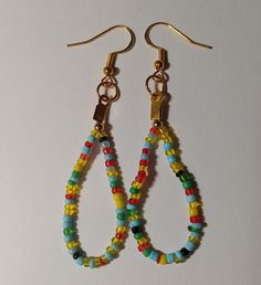 Multi Color ( red yellow green blue black gold) seed bead earrings Multicolor Dangle Beads With Ear Wire, Multicolor Beaded Earrings With Gold Beads As Gift, Yellow Dangle Hoop Earrings With Colorful Beads, Rainbow Earrings With Colorful Round Beads, Multicolor Beaded Chain Dangle Beads, Multicolor Round Beads Earrings With Gold Beads, Multicolor Teardrop Hoop Earrings With Dangling Beads, Multicolor Drop Earrings With Gold Beads, Rainbow Beaded Earrings With Ear Wire