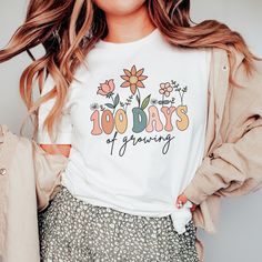 Celebrate your 100th day of school with this '100 Days of Growing' floral Teacher Shirt! Find more 100 days of school shirts and sweatshirts for your favorite teacher or student here. https://www.etsy.com/shop/JaxGraphicTees?search_query=100+days These t-shirts are Bella + Canvas 3001 Unisex shirts. They are a super soft fabric that will quickly become a go to in your wardrobe. Its lightweight and flexible material is perfect for casual wear or any activity. Sizing details: * All shirts are unis 100 Days Of School Sublimation, 100th Day Of School Shirts For Teachers, 100th Day Of School Shirts, 100days Of School Shirt, Christian Crewneck, 100 Days Of School Shirt, Scripture Shirt, Boho Christian, Gender Reveal Shirts