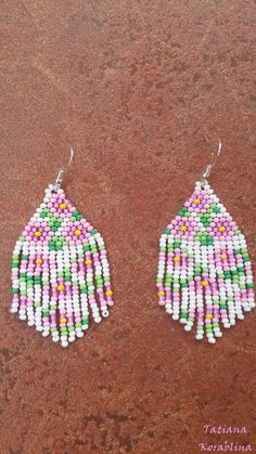 These handmade unique earrings with abstract floral print are made of high-quality Czech beads and strong synthetic thread. I use my author's scheme . These earrings are elegant, fashionable, and highly versatile, suitable for everyday wear. Color: white,pink, green, yellow . 100% hand made with love! Measurements: Length-about 7cm (with schwenze) , Width -3 cm Materials: Silver plated ear hooks Czech glass beads Nylon Thread White Flower-shaped Jewelry With Dangling Beads, Multicolor Handmade Teardrop Flower Earrings, Handmade Multicolor Teardrop Flower Earrings, White Beaded Earrings For Summer Gift, Traditional White Earrings With Ear Wire, Summer White Beaded Earrings For Gift, Summer White Beaded Earrings Gift, Summer White Flower Earrings With Colorful Beads, White Handmade Adjustable Earrings