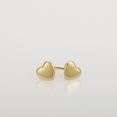 These are small gold heart earrings, handmade of 14k solid gold. Modern yellow gold heart stud earrings, with a highly shiny finish. These heart studs are perfect for every day's wear, and will look great with any style. They will add a chic gold touch and sparkle to your appearance. A wonderful gift for yourself or for someone you love. Heart's size is approx 6.8 x 6.2 mm = 0.26 x 0.24 inch Heart is 1.4 mm thick = 0.05 inch. 14k solid gold ear backs are included. *I can make these earrings in m Gold Minimalist Heart Earrings For Everyday, Yellow Gold Double Heart Earrings For Valentine's Day, Tarnish Resistant Yellow Gold Sterling Silver Heart Earrings, Classic Gold Heart Earrings With Heart Charm, Gold Classic Heart Earrings, Minimalist Everyday Heart Earrings, Tarnish Resistant, Classic Gold Heart Earrings, Minimalist 14k Gold Heart Earrings, Classic Yellow Gold Earrings For Valentine's Day