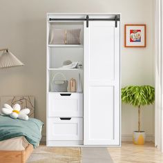 a bedroom with a bed, dresser and white closet doors that open to reveal the bathroom