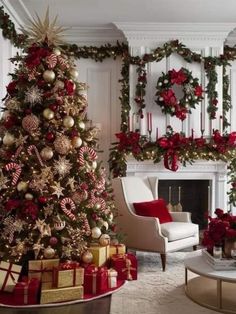 a living room decorated for christmas with red and gold decorations on the fireplace mantel