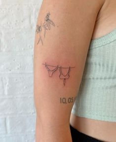 a woman's arm with tattoos on it and the numbers 10 to 20 below