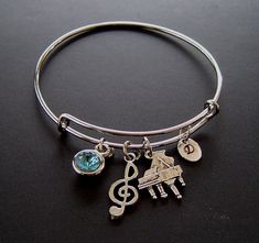 "Piano Musical Note Personalized Expandable Bangle Bracelet Hand Stamped Initial Birthstone,Silver Piano Musical Note charm, Music Bangle, Music Group gift - Antique Silver Piano Charm is 7/8\" x 5/8\"; -The Antique Silver Musical Note Charm is 26x10 mm; -The Antique Silver bangle is adjustable 2 1/2\" across and expands to 3\"; -The Antique Silver oval hand stamped Tag is 10x8mm; - Glass chaton crystal is set in antique silver bezel 7-11 mm - One Gift Box that show SAMPLE at 4th photo. ( color Music-themed Silver Metal Jewelry, Silver Music-themed Metal Jewelry, Music-themed Band Jewelry As Gift, Music-themed Band Jewelry Gift, Silver Music-themed Round Jewelry, Music-themed Bracelet Jewelry Gift, Adjustable Silver Music-themed Bracelets, Adjustable Silver Music-themed Bracelet, Silver Music-themed Bracelets For Gifts