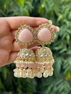 Beautiful engraved Jhumka earrings available in 2 stunning variations of pink. These earrings are high quality and are made to last. They are not too heavy and will be fine to wear all day long. They surely add a statement to any look! In case of any queries, please feel free to reach out. Happy shopping! Luxury White Jhumkas With Latkans, Luxury Tilla Jhumkas For Eid, Luxury Fusion Style Chandelier Earrings With Latkans, Luxury Hand Set Jhumkas For Diwali, Luxury Hallmarked Fusion Jhumkas, Luxury Jhumkas With Intricate Design For Anniversary, Luxury Ornate Jhumkas For Festivals, Cheap Jhumkas For Diwali Celebration, Luxury Jhumkas With Stone Work For Festivals