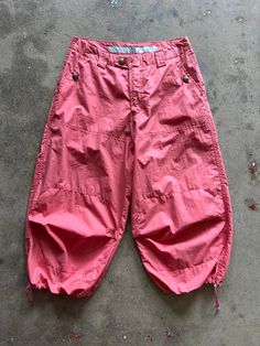 Super cool tech pants by Marithé + François Girbaud. Features salmon pink fabric, drawstring hems, and 4 pockets. Designer - Marithé + François Girbaud Size 8 Approximate measurements: Waist/Hip: 30" Inseam: 21" Rise: 10" Pink Wide Leg Pants With Drawstring, Pink Parachute Trousers With Side Pockets, Pink Utility Wide Leg Parachute Pants, Pink Wide Leg Utility Parachute Pants, Sporty Pink Cargo Pants, Sporty Pink Cargo Pants With Pockets, Functional Bottoms With Pockets For Spring, Pink Cotton Parachute Pants With Cargo Pockets, Functional Spring Bottoms With Pockets