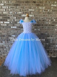 Dear customers, current processing time is 3-5 business days, if you need your order to arrive faster you can upgrade shipping at checkout Welcome to Little Dreams by Mayra This dress is absolutely adorable, puffy and adorable! It has three layers of tulle that makes it very puffy and princess style, skirt is made with turquoise tulle and glitter turquoise tulle Dress is a perfect match for a frozen party! or can be custom ordered to match your wedding color theme, Perfect for flower girls, pict Fitted Blue Ball Gown With Tulle Skirt, Blue Tulle Princess Dress For Quinceanera, Fitted Blue Ball Gown Pageant Dress, Blue Princess Ball Gown Pageant Dress, Blue Princess Pageant Dress, Blue Princess Style Pageant Dress, Blue Princess Fairy Dress For Dress-up, Blue Princess Style Fairy Dress For Dress-up, Fitted Fairy Style Princess Dress For Wedding