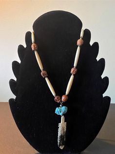 This listing features a vintage Native American styled  Bone carved Feather & Turquoise Necklace that also features little hand carved wooden skull beads Diy Feather Headband, Wooden Skull, Native Necklace, Skull Beads, Native American Necklace, Turquoise Jewelry Native American, Native American Style, Feather Headband, Native American Fashion