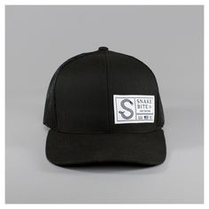 Snake Bite Standard Series Snapback Hat USA Made | Snake Bite Co. Fitted Black Trucker Hat, Black Fitted Trucker Hat, Black Snapback Hat With Letter Print And Curved Bill, Black Trucker Hat With Letter Print For Outdoor, Black Trucker Hat With Letter Print And Flat Bill, Black Hats With Logo Patch, One Size, Fitted Black Trucker Snapback Hat, Black Fitted Trucker Snapback Hat, Black Trucker Hat With Letter Print And Curved Brim