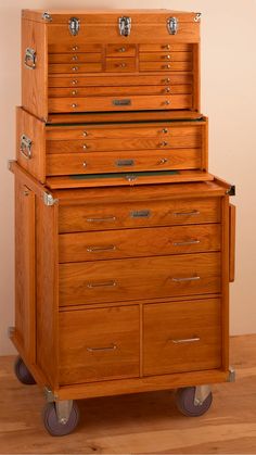 an old fashioned wooden chest on wheels