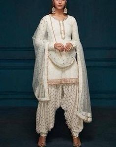 Ivory embroidered Indian wedding kurta with brocade patiala shalwar and embroidered dupatta. This is a custom made garment which include the top (kurta) salwar (pant)and dupatta (stole). Kurta fabric is georgette and salwar fabric is brocade and dupatta material is Net. It can be customised in any color of your choice. Kurta length can be made according to your measurements. Upon order confirmation, we will send you a measurement form which you will need to fill in inches. Care- Dry clean only. Punjabi Salwar Kameez, Blue Sherwani, Wedding Kurta, Indian Wedding Lehenga, Indian Dresses Online, Unique Bridesmaid Dresses, Punjabi Salwar, Traditional Dresses Designs