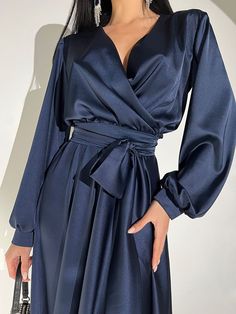 Fabric: Satin 60% polyester, 38% viscose, 2% elastane Longsleeve Maxi length V-neckline Wrap dress Belt included Dress length: 144 cm Sleeve length: 61 cm Color: white, black, beige, navy blue, emerald Size: S, M, L, XL Elegant Solid Color V-neck Party Dress, Chic Long Sleeve V-neck Evening Dress, Elegant Dress With Solid Color And Surplice Neckline, Elegant Dress With Surplice Neckline In Solid Color, Elegant Solid Color Dress With Surplice Neckline, Elegant Surplice Neckline Dress In Solid Color, Elegant V-neck Dress With Surplice Neckline For Fall, Elegant Long Sleeve V-neck Dress For Night Out, Solid Long Sleeve Wrap Dress For Formal Occasions