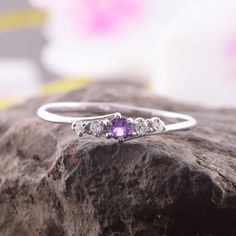 "Amethyst ring, Minimalist ring, Dainty rings, Promise ring silver, Silver ring women, Round cut ring silver, Purple stone ring, Tiny rings WE OFFER UNLIMITED PERIOD INSTALLMENTS PLAN This is a beautiful, stunning, feminine ring that works well for all occasions, styles, and ages. You will love it! Ring information Main stone: Amethyst Approximate size: 3.0mm Accent stones: White cubic zirconia Approximate size: 1.5mm (2 stones) Approximate size: 1.25mm (2 stones) Metal type: Silver Metal stamp: Crystal Open Ring With Prong Setting For Promise, Cubic Zirconia Stackable Rings For Promise, Promise Crystal Open Ring With Birthstone, Dainty Crystal Open Ring With Prong Setting, Fine Jewelry Crystal Open Ring For Promise, Cubic Zirconia Midi Rings For Promise, Elegant Silver Crystal Ring With Simple Design, Dainty White Gold Crystal Promise Ring, White Gold Midi Rings For Promise