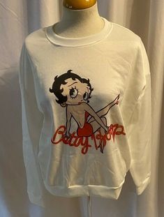 NWT CDJLFH Women's  XXL White Pull On Sweatshirt Betty Boop  FREE SHIPPING This item is Brand New with tags.  Please let me know if you have questions. Thank you for Looking!  NWT CDJLFH Women's  XXL White Pull On Sweatshirt Betty Boop  FREE SHIPPING Cotton/ Polyester 19 In Sleeves, 44 In Bust, 24 In. Length Oversized Y2k Tops With Cartoon Print, Oversized Long Sleeve Top With Character Print, Y2k Long Sleeve Tops With Cartoon Print, White Y2k Crew Neck Sweater, Retro Winter Tops With Cartoon Print, Trendy Winter Tops With Character Print, Retro Long Sleeve Tops With Character Print, Vintage Long Sleeve Tops With Cartoon Print, Betty Boop Shirt