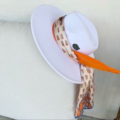 This Fedora Style Hat Is Adjustable And Fits Most. Cotton/Poly Blend Hat With Flat Brim Stiff Dent And Pinch Fedora Shape Brim Measures 7.5 Cm / 3.74” Crown Measures 11 Cm / 4.33" Tall 56-58cm Adjustable Band White Flat Brim Panama Hat For Kentucky Derby, White Fedora Panama Hat For Kentucky Derby, Chic White Hat Bands For Kentucky Derby, White Brimmed Fedora For Kentucky Derby, Chic Adjustable White Hat Band, Chic White Adjustable Hat Bands, White Panama Hat With Short Brim For Spring, White Summer Panama Hat For Kentucky Derby, White Fedora Hat For Kentucky Derby