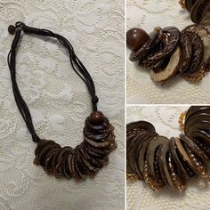 Lovely handmade bohemian wooden beaded necklace from Bali, Indonesia! 🥥 Gorgeous collection of round wooden discs made from coconut wood mixed with gold and bronze beaded discs. Rope/fabric chain that does up with little wooden button 🥥 Lovely condition! Message me if you need exact measurements.  Shown on size 12 model 5ft tall for reference.  Any questions please ask x  Tags- vintage retro 50s 60s 70s 80s beach casual boho indie festival summer sun holiday bohemian earthy beaded indian natur Artisan Brown Beaded Necklace For Beach, Bohemian Brown Beaded Round Necklaces, Bohemian Brown Beaded Necklace, Earthy Natural Beaded Necklace, Wooden Beads Round Necklace For Beach, Adjustable Artisan Natural Wood Necklace, Adjustable Brown Beaded Necklace For Beach, Adjustable Brown Beaded Round Necklace, Adjustable Brown Wooden Necklaces