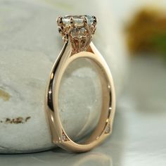 Antique Modified Design- A single round brilliant 7mm Aquamarine is set creatively in the center of a basic solid 14k rose gold with two VS diamond on each side of a knife edge band. This eight-prong setting is perfect for a spectacular night out with your love ones. R101E-7mm-AQUA-14KRCenter Stone*Natural AAA Quality Aquamarine*Aqua Blue, Eye-clean (VS1 clarity) *7x7 mm Round Brilliant cut *Approx. gemstone weight: 1.20 caratsSide Stone*Conflict Free Natural White Diamonds*Round Brilliant Cut * Formal 14k Rose Gold Ring With Prong Setting, Rose Gold Diamond Ring With Tension Setting, Timeless 14k Rose Gold Diamond Ring For Formal Occasions, Rose Gold Ring With Tension Setting, Rose Gold Single Diamond Promise Ring, Promise Jewelry In Rose Gold With Tension Setting, Vvs Clarity Diamond Ring In 14k Rose Gold, Rose Gold Solitaire Ring With Round Cut, Rose Gold Round Cut Diamond Ring With Center Stone