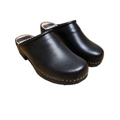 Experience Unmatched Comfort and Style;  Black Wooden Clogs crafted from natural cowhide leather, our 2mm-thick black colored clogs redefine comfort and elegance. Glide through your day with ease, knowing these wooden shoes provide the perfect balance of support and flexibility. Premium Material, Superior Quality;  Step into luxury with our closed toe wooden clogs, meticulously designed for clogs women. The durable upper crafted from natural cowhide leather promises longevity, while the real wood and PU rubber bottom offer stability without the traditional clacking sound. Elevate your footwear collection with these premium, versatile clogs. Unleash Your Style Statement;  With their sophisticated design and attention to detail, our Swedish clogs in black leather are more than just shoes - t Comfortable Leather Clogs With Wooden Heel, Casual Closed Toe Wooden Clogs, Casual Wood Closed Toe Clogs, Wooden Clogs With Round Toe, Wooden Clogs With Round Toe And Wooden Heel, Wooden Mules With Rubber Sole And Round Toe, Natural Wood Round Toe Clogs, Black Slip-on Clogs With Rubber Heel Cap, Natural Clogs With Rubber Sole And Round Toe