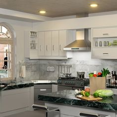 a kitchen with marble counter tops and white cabinets, along with an island in the middle