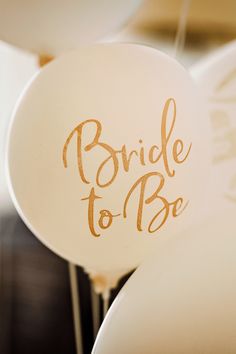 balloons with the words bride to be written on them