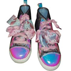 Jojo Siwa Metallic Iridescent Lace Up High Top Sneakers Size 3, Never Wore Only Tried On Brand Jojo Siwa Color Multicolor Material All Man Made Style Iridescent Toes And Accents, High Tops, Lace Up Closure , Embellished With A Large Bow, Silver Metallic Shoes Size Usa 3 / Eur 35 / Mex 22 Care Machine Wash Cold Water Air Dry Condition New Without Tags Good Condition Please Refer To All Pictures As They Are Part Of The Listing Made In China Features: Iridescent Toes And Accents, High Tops, Lace Up Trendy Multicolor Glitter Sneakers, Multicolor Sneakers For Spring Party, Iridescent Synthetic Round Toe Sneakers, Multicolor Casual Party Sneakers, Casual Multicolor Party Sneakers, Multicolor Low-top Party Sneakers, Purple Round Toe Party Sneakers, Silver Low-top Sneakers, Silver Metallic Shoes