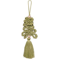 a green tasselled ornament hanging from a string on a white background