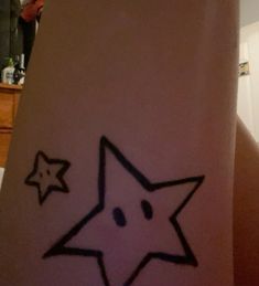 a person with a star tattoo on their arm