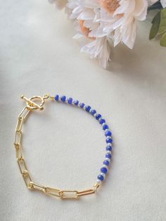 This beautiful bracelet is made using sapphire, freshwater pearls, 14k gold plated chain, and 24k gold plated findings. This bracelet is perfect to wear on a wedding or even daily use! You can choose the length of it in the variations, if you can't find the length that fits you, f eel free to send me a message!  Things included in your package (bubble mailer) : -your order -thank you card -extras (stickers or candy) Make sure you follow my Instagram @jewelrybynausheen for amazing jewelry posts and shop updates! Elegant Blue Chain Bracelet For Everyday, Elegant Blue Chain Bracelet As Gift, Elegant Blue Chain Bracelet For Gift, Dainty Blue Crystal Bracelet For Gift, Blue Dainty Crystal Bracelet Gift, Dainty Blue Crystal Bracelet Gift, Elegant Blue Charm Bracelet With Round Beads, Crystal Chain Bracelet Gift, Blue Beaded 14k Gold-filled Jewelry