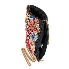 A modern beaded & embroidered floral pattern dances across a field of rich blue embroidery on this fashion-forward crossbody phone bag. 5 x 0.5 x 8" Strap Length End to End: 51" Strap Drop: 24" Removable crossbody chain strap Top compartment Side zipper compartment Fits a phone Includes metal logo fob This is a handmade item, each one an individual work of art. Slight variations may occur. Learn More about our Global Impact Chain Strap Top, Crossbody Phone Bag, Big Handbags, Mary Frances, Purse Gift, Best Handbags, Handmade Purses, Blue Embroidery, Top Handle Handbags