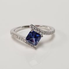 "Thanks for shopping our vintage estate store. We tend to sell well below wholesale and truly hope you enjoy all of our items. Many of the items are one of a kind, so please enjoy scrolling through the pictures and hopefully something will catch your eye. Brown spots are from camera. Estate Sterling Silver 925 lab created princess cut 1ct tanzanite cz diamonds ring. This is a custom made item from our shop, meaning we added the gem to the setting. Ring size: please select a size Setting: 3/8\" 9 Classic Princess Cut Cubic Zirconia Birthstone Ring, Classic Silver Princess Cut Birthstone Ring, Classic Princess Cut Crystal Anniversary Ring, Classic Princess Cut Crystal Ring For Anniversary, Silver Princess Cut Sapphire Ring For Formal Events, Anniversary Hallmarked Cubic Zirconia Birthstone Ring, Anniversary Crystal Ring Princess Cut Fine Jewelry, Fine Jewelry Princess Cut Crystal Ring For Anniversary, Princess Cut Crystal Ring For Anniversary