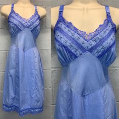 Vintage poly cotton rayon blend semi sheer slip dress with floral embroidery at the bust. Lace trim.  Adjustable ribbon straps.  Hand dyed a darker shade of periwinkle.  Good condition.   No noted flaws.  There may be some minor inconsistencies in color due to the hand dyed nature of the garment.  Fits most like a size medium large.  Laid flat and measured.  Bust (armpit to armpit) - 19 inches  Waist - 16 inches  Hips - 21 inches  Length  Shortest - 39 inches  Length - 44 inches Fitted Cotton Slip Dress For Spring, Fitted Cotton Slip Dress For Daywear, Sheer Slip Dress, Floral Embroidery, Hand Dyeing, Lace Trim, Favorite Outfit, Slip Dress, Bathing Beauties