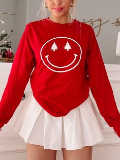 Christmas Tree Smiley Tee | Sassy Shortcake | sassyshortcake.com Fun Long Sleeve T-shirt With Screen Print, Red Long Sleeve Christmas T-shirt, Red Long Sleeve T-shirt For Winter, Red Long Sleeve Winter T-shirt, Red Long Sleeve T-shirt With Screen Print, Fun Winter Crew Neck T-shirt, Fun Crew Neck T-shirt For Winter, Casual Long Sleeve Christmas T-shirt, Funny Print Long Sleeve T-shirt For Winter