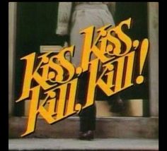 a man standing in front of a door with the words kiss kill on it