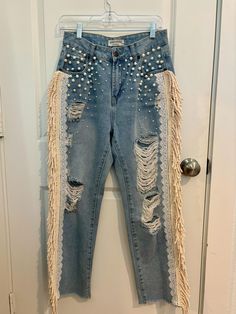 Size:  5 Waist:  28" Hips:  40" (measured 10" down from waist).  In seams:  27 1/2" This is a very beautiful jeans for very special occasions.  Wear it to your bachelorette parties, country wedding, concerts/festivals.  It's embellished with pearls, lace and cream fringes that adds a lot of drama ina subtle way.  It's  romantic, classy and vintage fashion style.  It's truly a wearable art/statement piece. Bohemian Summer Jeans With Frayed Hem, Bohemian High Rise Fitted Jeans, Denim Bottoms With Fringe And Straight Leg, Denim Straight Leg Bottoms With Fringe, Denim Straight-leg Bottoms With Fringe, Summer Embellished Straight Leg Jeans, Bohemian Fitted Bottoms For Wedding, Bohemian Fitted Wedding Bottoms, Fitted Fringe Jeans For Spring