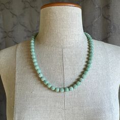 "Style: Estate Burmese jade round bead necklace, natural color fei cui, with a matching silver clasp. 58 beads Material: Natural Jadeite, jadeite, vintage, Burmese jade, green, silver clasp Method: fine polished Type: Necklace, bead necklace Size: bead size 9mm, length 23\" no.7" Elegant Round Amazonite Necklace, Elegant Round Jade Beaded Necklaces, Elegant Amazonite Bead Necklaces, Elegant Turquoise Necklace With 8mm Beads, Elegant Amazonite Beaded Necklace, Classic Jade Necklaces With Round Beads, Classic Jade Necklace With Round Beads, Elegant Jade Necklaces With Round Beads, Elegant Turquoise Jade Necklace