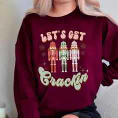 Description: Lets get crackin' ! One of my most beloved movies around Christmas time was, The Nut Cracker, so I absolutely adore this beautiful holiday design. This sweatshirt would make an amazing retro style gift for your person. It has that cute faded vintage look with a comical twist. Would be the perfect Christmas Eve or Secret Santa gift.  Details: This sweatshirt is a crewneck Gildan 18000 and is unisex sizing. This garment runs true to size and is cotton. Novelty Christmas Crew Neck Top, Christmas Novelty Crew Neck Tops, Novelty Crew Neck Tops For Christmas, Retro Christmas Shirt, Beloved Movie, Nut Cracker, Sweatshirt Christmas, Secret Santa Gifts, Look Vintage