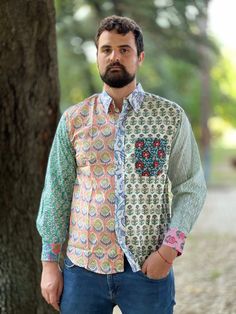 This funky patchwork 100% cotton shirt is handmade and block printed. It features long sleeves and a pocket in an upper left side. It closes by buttons. This shirt is free from the dictates of mass production being handmade by skilled woodblock artisans using exclusively local high quality cotton. It is somehow exotic, funky and fun but at the same time stylish in an own particular way. SIZE Shoulders 50 cm Chest 116 cm Sleeve 61 cm Length 75 cm This item is handmade so it may present minor irre Casual Multicolor Print Shirt With Patchwork, Casual Multicolor Patchwork Print Shirt, Patterned Patchwork Long Sleeve Tops, Multicolor Printed Long Sleeve Shirt, Multicolor Long Sleeve Printed Shirt, Spring Patchwork Patterned Shirt, Cotton Long Sleeve Shirt With Patchwork, Long Sleeve Cotton Shirt With Patchwork, Bohemian Patchwork Shirt For Summer