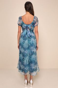 Let the romantic vibes of the Lulus Lovely Statement Teal Blue Floral Organza Tie-Back Midi Dress make you feel effortlessly flirty for any special occasion! Airy woven organza, with a blue and green floral design throughout, shapes this gorgeous dress that features a princess-seamed bodice, a sweetheart neckline with a notched detail and supportive V-bar, and sheer puff sleeves (with elastic at the shoulders and cuffs). The high, fitted waist tops a twirl-worthy, skater-style skirt that finishe Flowy Organza Dress For Garden Party, Blue Silk Chiffon Summer Dress, Organza Dress With Floral Print For Evening, Blue Organza Dress For Wedding Guest, Fitted Silk Chiffon Dress For Wedding Guest, Feminine Blue Dress For Wedding Guest, Blue Silk Chiffon Dress, Feminine Blue Silk Dress, Chic Blue Organza Dress