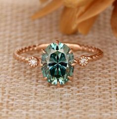 Emerald And Moissanite Ring, Labrodite Engagement Ring, 3 Stone Birthstone Ring, Whimsical Emerald Engagement Ring, Blue Green Moissanite Ring, Emerald Engagement Ring Rose Gold, Oval Cut Emerald Ring, Emerald Antique Ring, Green Montana Sapphire Engagement Ring