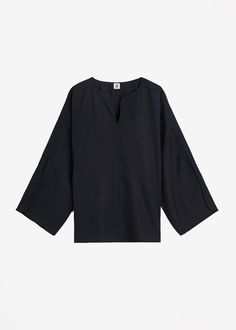 Color: Black Lightweight fluid fabric Relaxed fit V neckline Split dolman sleeves Slip on style Unlined 100% Acetate Machine Wash Cold By Malene Birger. Imported Versatile Batwing Sleeve Workwear Tops, Versatile Batwing Sleeve Tops For Workwear, Black Split Neck Top For Summer, Black Split Neck Tops For Summer, Elegant Oversized V-neck Top, Versatile Black Viscose Blouse, Chic Workwear Blouse With Kimono Sleeves, Black Kimono Sleeves Top For Spring, Chic Blouse With Kimono Sleeves For Work