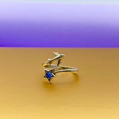 Ring Silver Airplane with blue star for aviation lovers. Material: silver 925o Weight: 2.3 gram Silver ring with plane and beautiful blue stone. Silver 925. One size. You may change size by yourself. The best gift for flight attendants. Ring of people who love travel. == With this ring we recommend == https://www.etsy.com/listing/831307662/silver-necklace-with-airplane-infinity?ref=shop_home_active_7&frs=1&cns=1 Nickel-free Sterling Silver Star Ring, Star-shaped Sterling Silver Sapphire Ring, Sterling Silver Star-shaped Sapphire Ring, Silver Star-shaped Sapphire Ring As Gift, Star-shaped Silver Sapphire Ring, Blue Sterling Silver Star-shaped Ring, Travel Ring, Flight Attendants, Gold Necklace Set