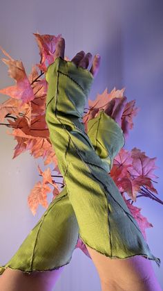 Wearable leaves! Don these leaf gauntlets to elevate your LARP, Ren Faire, or fantasy costume. Made out of a polyester/spandex stretch taffeta or 100% cotton stretch velour with embroidery details to mimic fresh leaves. Last day to order in time for CHRISTMAS: DEC 18th NEW FALL COLORS: Sugar Maple, Pumpkin, Cauldron Approx. 15 inches long from tip to tip.  Looking for a different color? Contact me for a custom listing! Short Leaf Wristlets are also available in the shop! Extra Detailed Dewdrop G Leaf Gloves, Leaf Armor, Fairy Costume, Fantasy Costumes, Embroidery Details, Mitten Gloves, Larp, Playing Dress Up, Arm Warmers