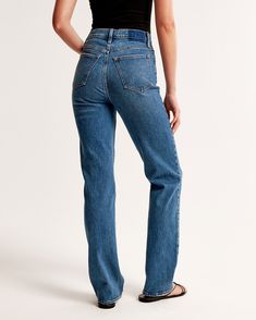 Step back into the '90s with the Abercrombie & Fitch Women's Ultra High Rise Straight Jeans, a perfect blend of vintage charm and modern comfort. These jeans are designed to flatter with an ultra high rise of 11.5 inches and a sleek straight leg that eases through the thigh, offering a structured yet relaxed fit. 

- Size: 34 LONG
- Color: Medium Wash
- Material: Body - Cotton, Elastane; Pocket Lining - Polyester, Cotton
- Gender: Female
- Age Group: Adult

Crafted from vintage stretch fabric, t Classic Fitted Flare Jeans For Everyday, Medium Wash Fitted Bottoms With Straight Hem, Classic Fitted Medium Wash Flare Jeans, Everyday Fitted Flare Jeans In Rigid Denim, Classic Fitted Flare Jeans In Medium Wash, Everyday Fitted Straight Leg Jeans, Summer Classic Flare Jeans With Straight Hem, Fitted Straight Jeans For Spring, Classic Fitted Jeans With Straight Hem