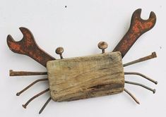 an old wooden object with metal handles and antlers on it