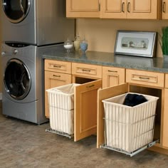 a kitchen with wooden cabinets and white baskets