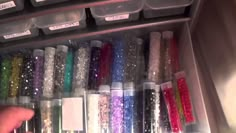 a drawer filled with lots of different colored glitters