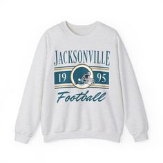 WELCOME TO MY SHOP! This Jacksonville Football Crewneck, Vintage Jacksonville Football Sweatshirt, Jaguars Sweatshirt, Jacksonville Sweater, Jacksonville Gifts, Game Day Shirt, Jacksonville Jaguars, Jaguars Sweater, Jaguars T-Shirt, College Gifts, Football Lovers, Gift for her, Gift for him, American Football, Super Bowl Shirt, Christmas Gifts, Birthday Gifts, Sunday Football, Jaguars Football Retro Crewneck Hoodie, Retro 90s Jacksonville Unisex Sweater, Vintage Football Sweatshirt, Jaguars Fan, Throwback Long Sleeve T-shirt For Sports Events, Throwback Long Sleeve Tops For Game Day, Game Day Throwback Long Sleeve Sweatshirt, Throwback Crew Neck Hoodie For Game Day, Throwback Long Sleeve Sweatshirt For Game Day, Fan Apparel Crew Neck Hoodie, Retro Long Sleeve Pre-shrunk Sweatshirt, Throwback Long Sleeve Tops With Letter Print, Team Spirit Hoodie For Fall