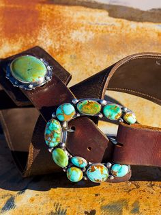 My love for old leather began when I moved out West. I search the world over, through barns saddle shops and ranches, for old retired saddle leather. This leather is the backdrop for my "Wild West" vintage leather belts! Shown here with perfect Kingman Turquoise oval concho, on 3 inch wide vintage leather. These look amazing with any of our Mas Grande Turquoise buckles. These belts sport two conchos measuring around three inches each! Buckles are sold separately. Some of this leather is over 100 Vintage Bridle Leather Belt With Antique Buckle, Vintage Turquoise Belt With Concho, Vintage Hand Tooled Leather Belt Buckles, Rustic Leather Belt For Rodeo, Southwestern Leather Belt Buckles For Rodeo, Rustic Leather Belt Buckles For Rodeo, Southwestern Leather Belt Buckles For Western-themed Events, Rustic Leather Belt Buckles For Ranch, Artisan Leather Belt Buckle With Antique Design